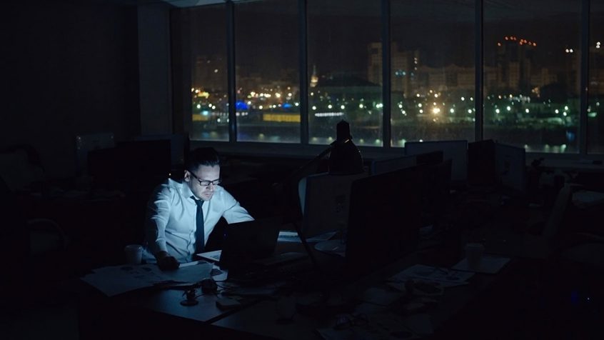 Man working late in dark office